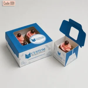 Blue cupcake boxes with clear window showing pink frosted cupcakes, one box open and one closed